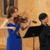 Violinist plays beside pianist