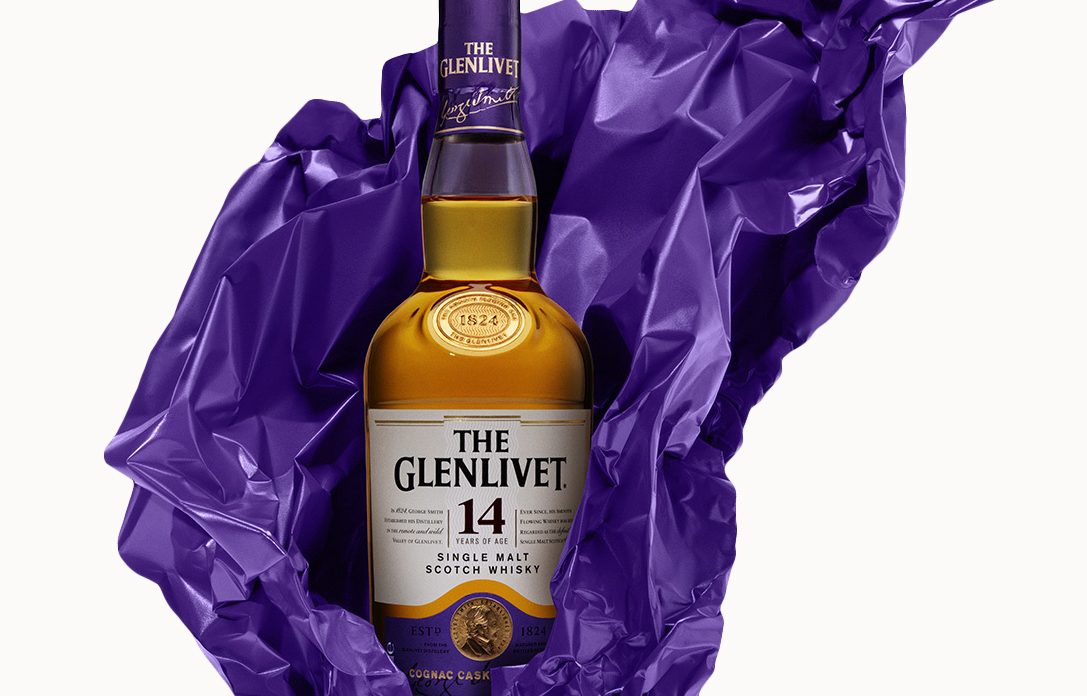 glenlivet 14 year old scotch in purple tissue paper