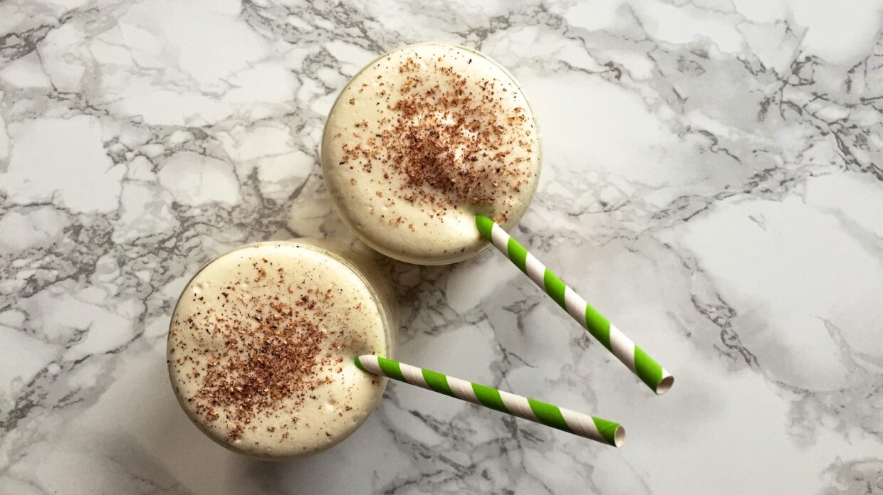Two creamy cocktails next to each other.
