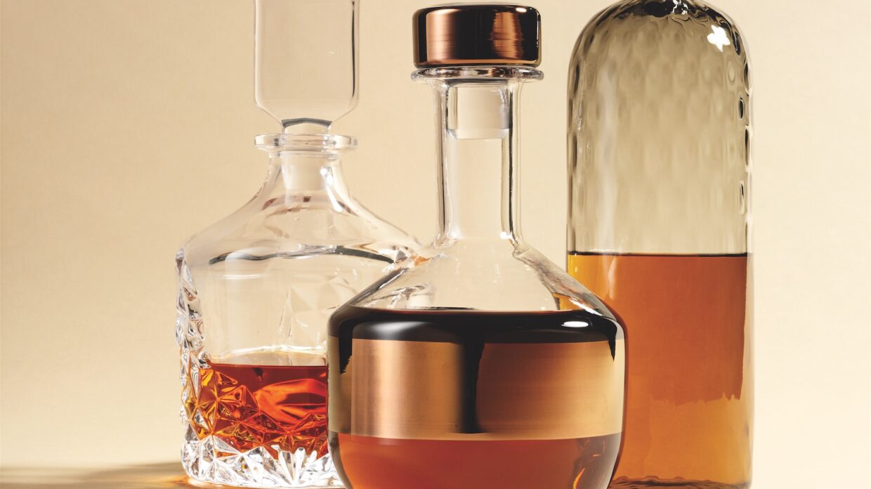 A trio of whisky decanters.