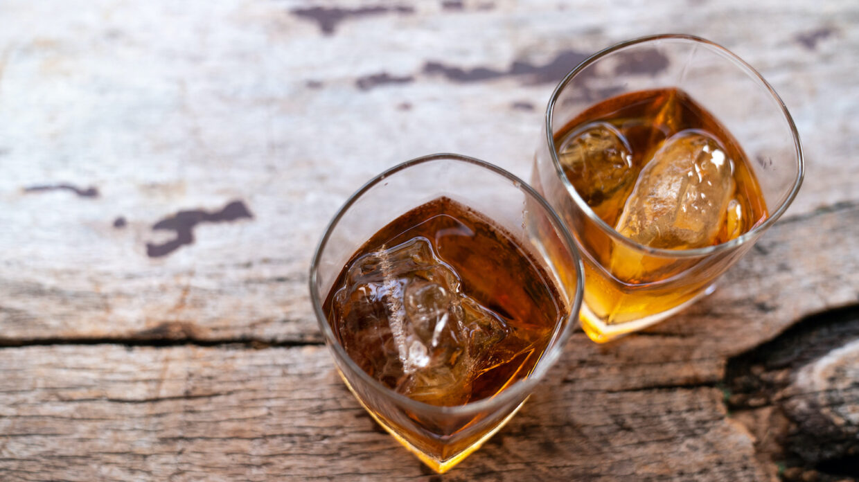 Two rye whiskey cocktail drinks toasted together