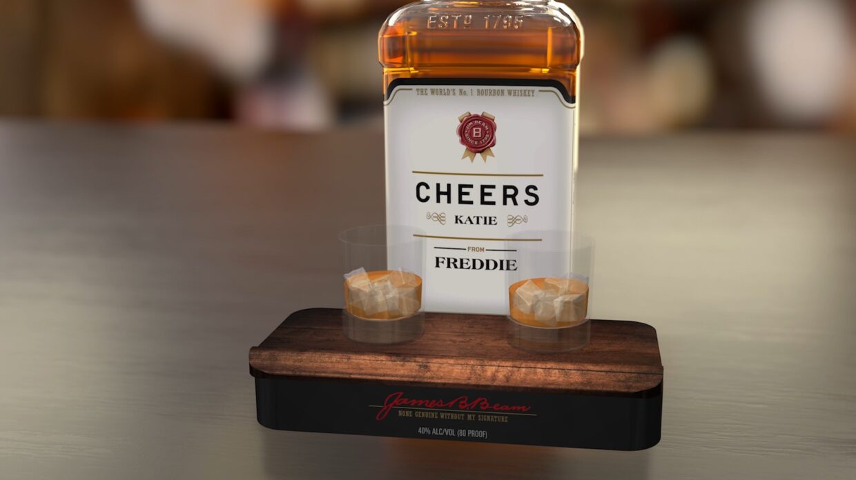 A bottle of Jim Beam bourbon with a personalized message on it.