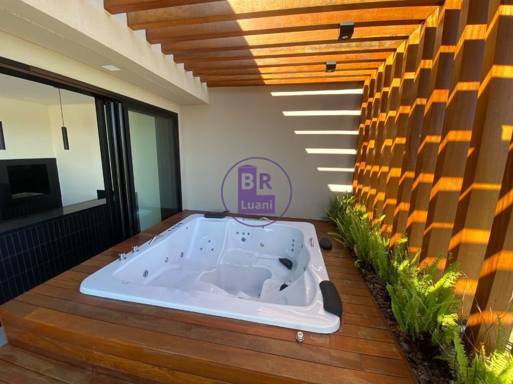 Residência Exclusiva com 4 Dormitórios e Espaço Gourmet no Condomínio Araçari.