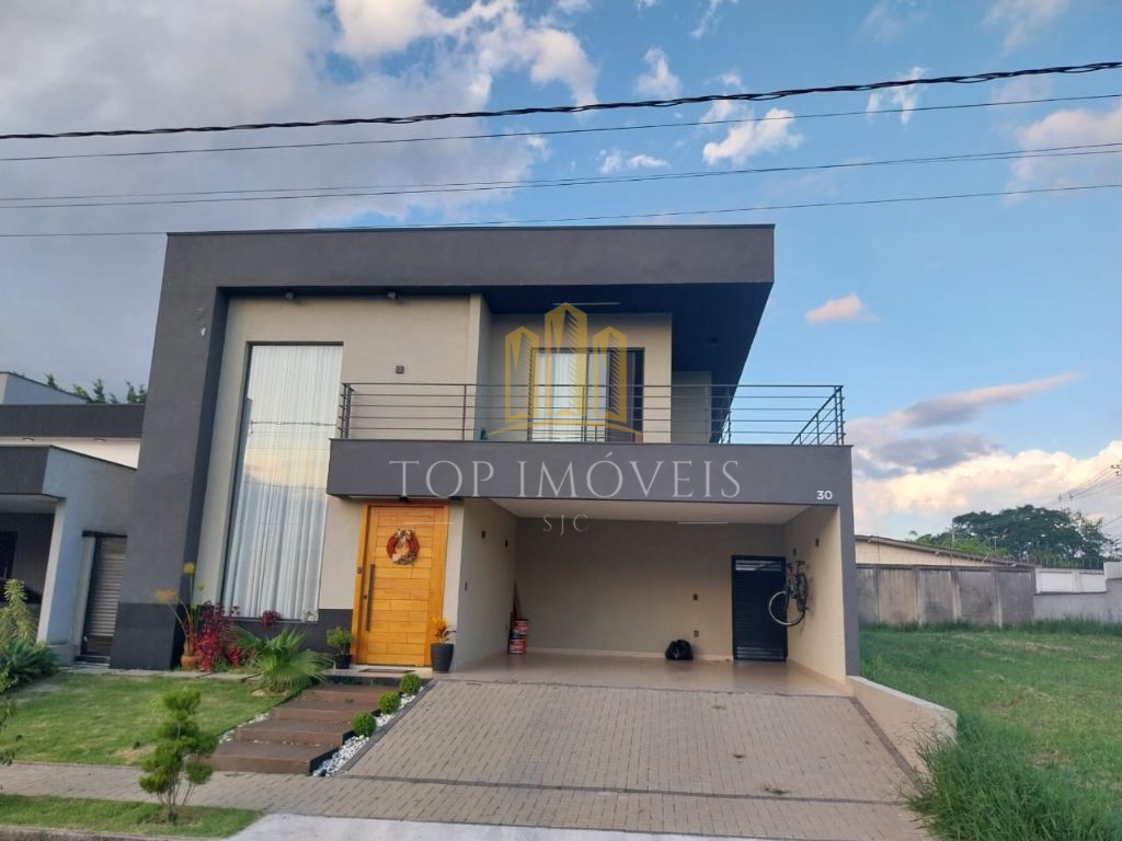 Casa assobradada com piscina no residencial ouroville em caç