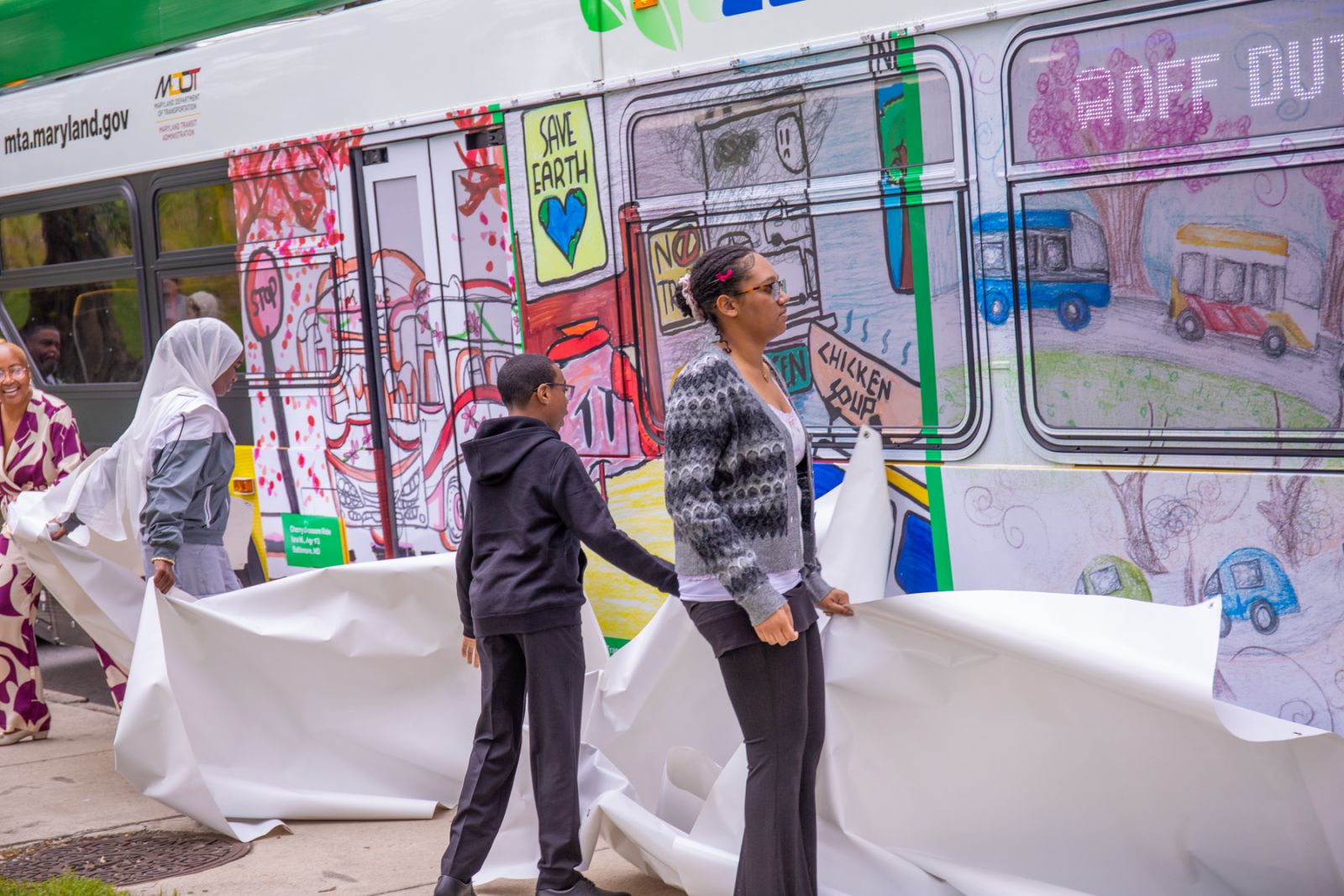 Earth Day art finalists reveal their artwork on one of MTA's Zero Emission Buses