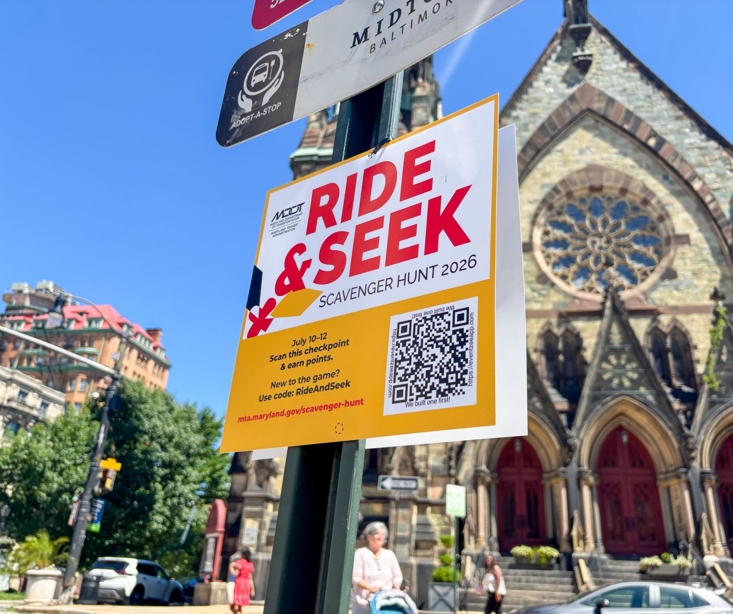 Ride & Seek scavenger hunt sign with QR code at a transit destination
