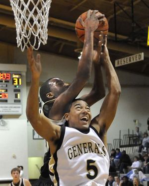 2009 Graduate Leo Liburd goes for a rebound vs a Clarksville player in a game vs the Generals in 2008.