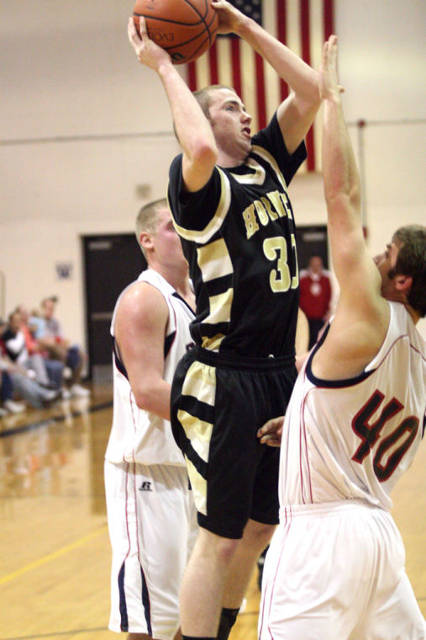 2011 Henryville Graduate Dylan Wolf puts up a shot vs Southwestern (Hanover) in 2011.