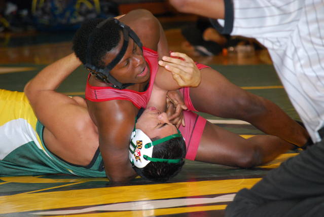 Senior Kamil Williams takes oppnent down with a headlock.