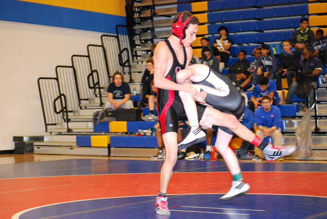 Senior Ricky Chavez wrestles in the JV Tournament