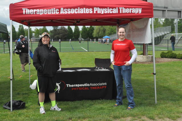 Amy Tanous and her associate work the sponsor booth for Theraputic Associates. TAI has partnered with TVLAX in a generous sponsorship of both the Oregon Cup and the End of Season Jam. Players were treated to TAI sunglasses and chapstick!