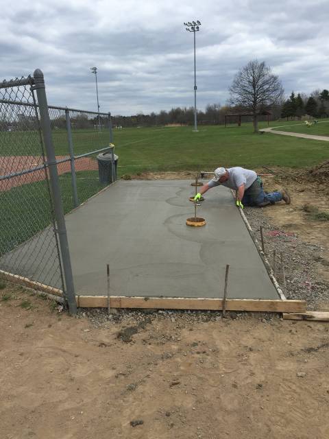 New pad being finished. Benches will be installed using the three circular footings.