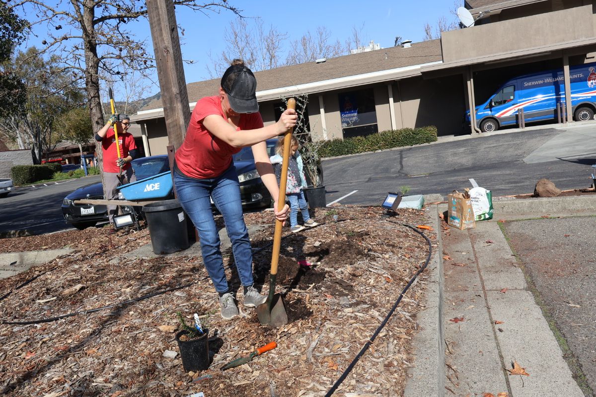 Jessica digging in front of the cross