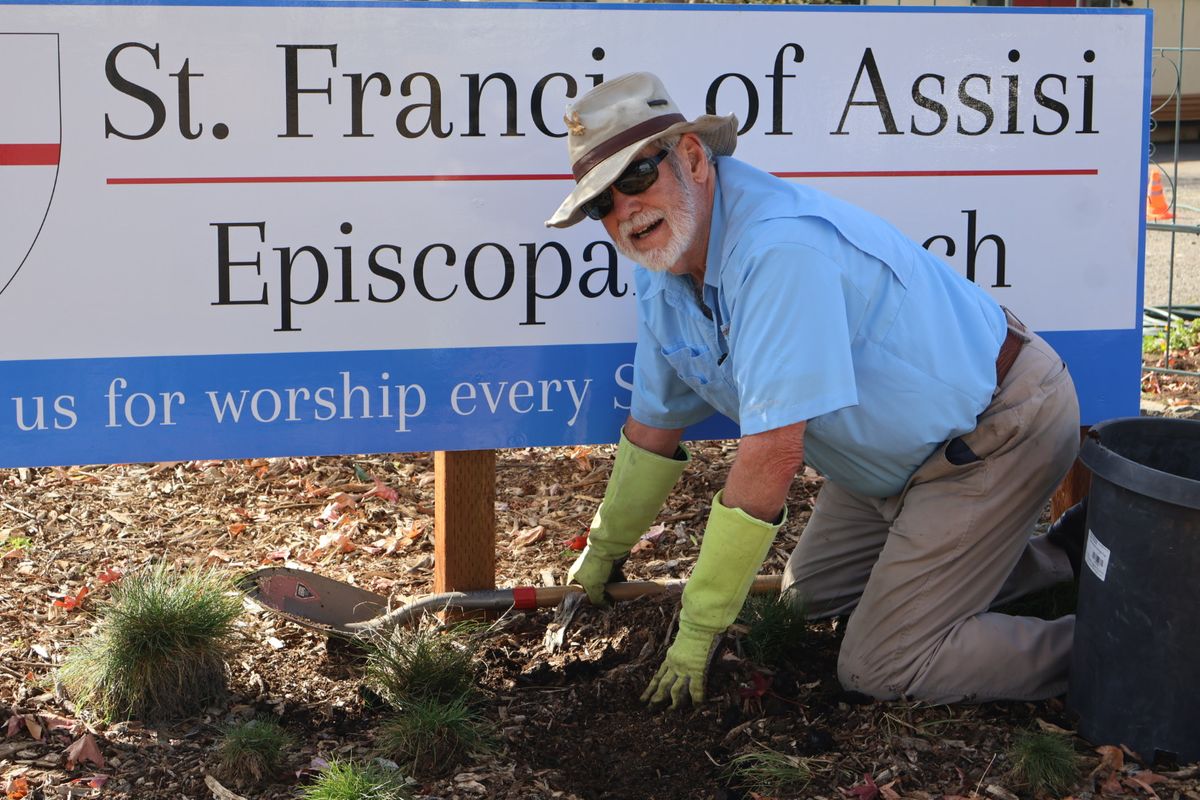 Tony in front of our sign!