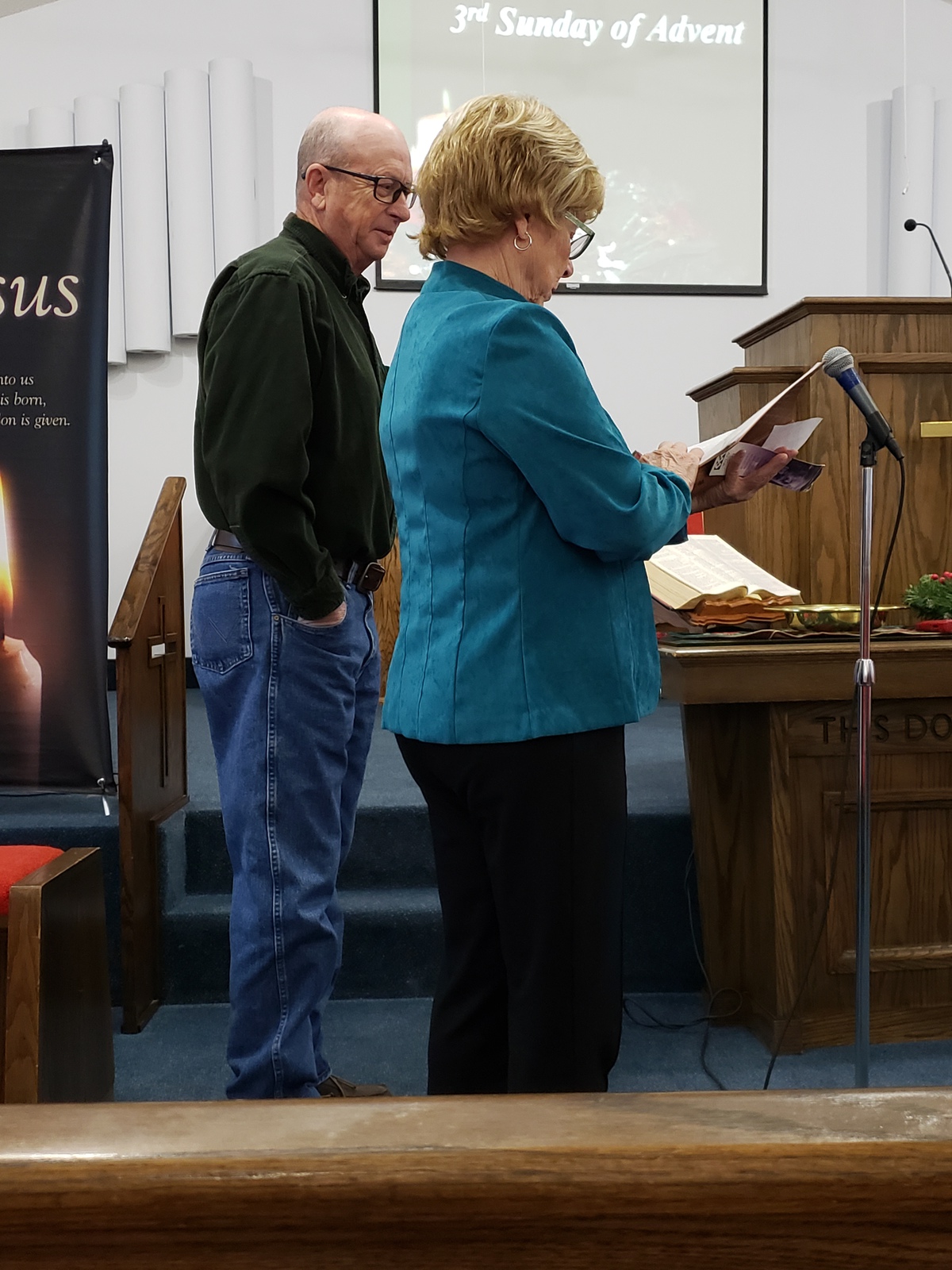Lighting of the Advent Candle is Richard Lame & Barbara Perry