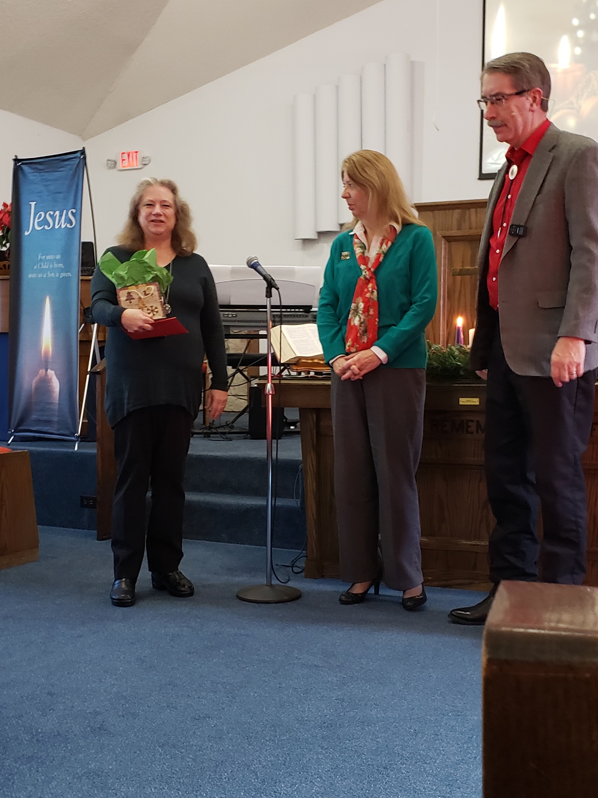 Cara Presents Christmas Gifts from the Church to Pastor Bruce & Shirley