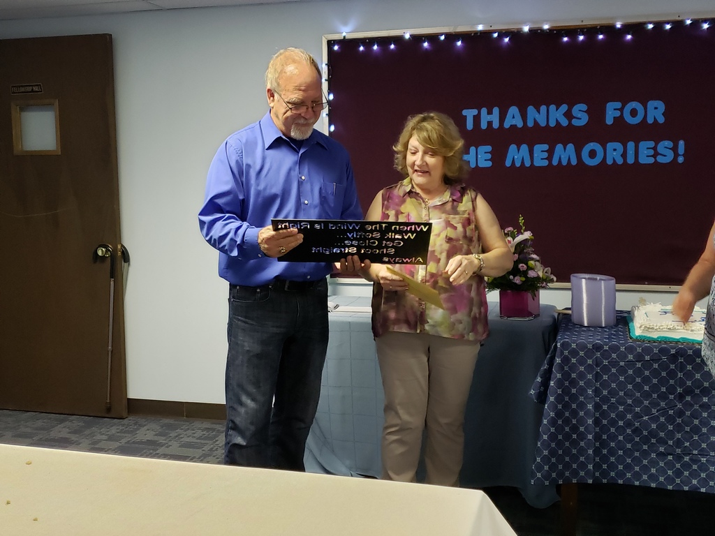 Pastor & Joyce with their gifts from the church