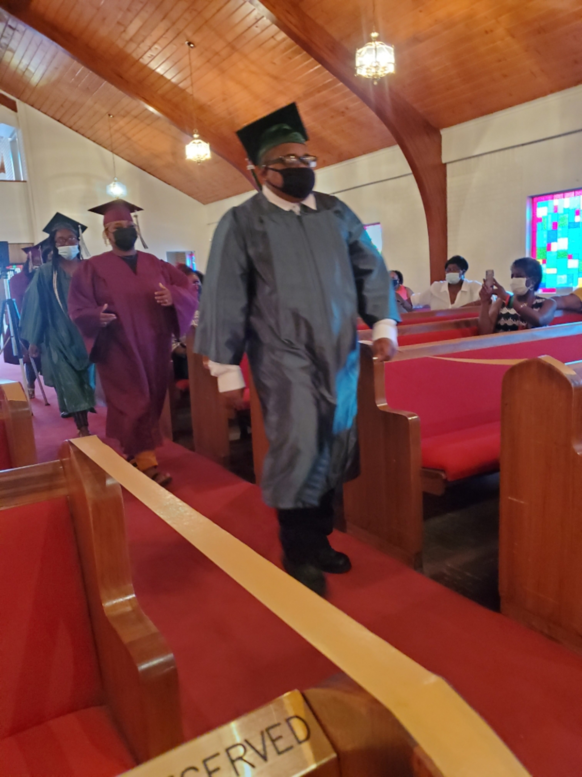 Graduates Joeriah Sweed followed by Lenijah Christine Jackson - Roshainah Tompkins - Kayleigh Bonner and Temaja Hooper
