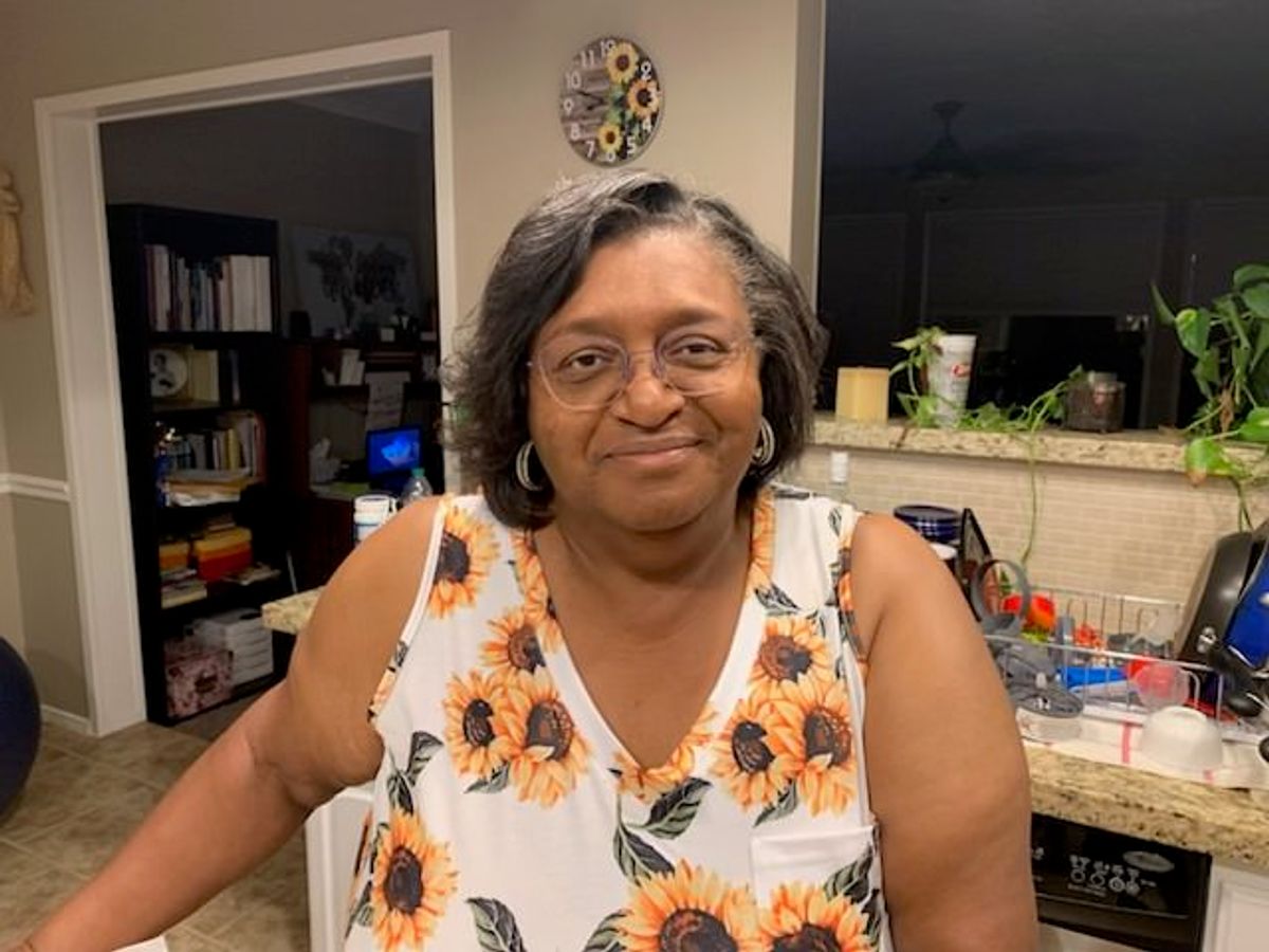 Kim presents a bright smile that matches her bright dress!