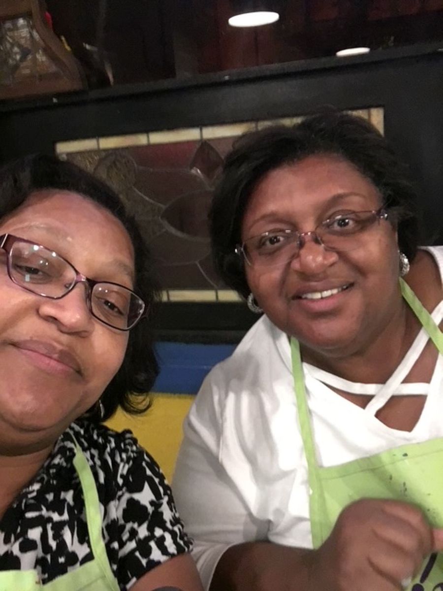 Sheryl and Kim don proud expressions.