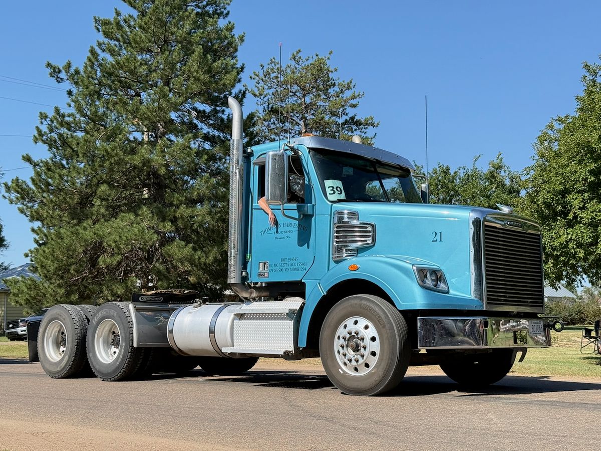 Parade Entry: 2021 Freightliner owned by Thompson Harvesting & Trucking. Driven by Dale Martin, a driver for the company
