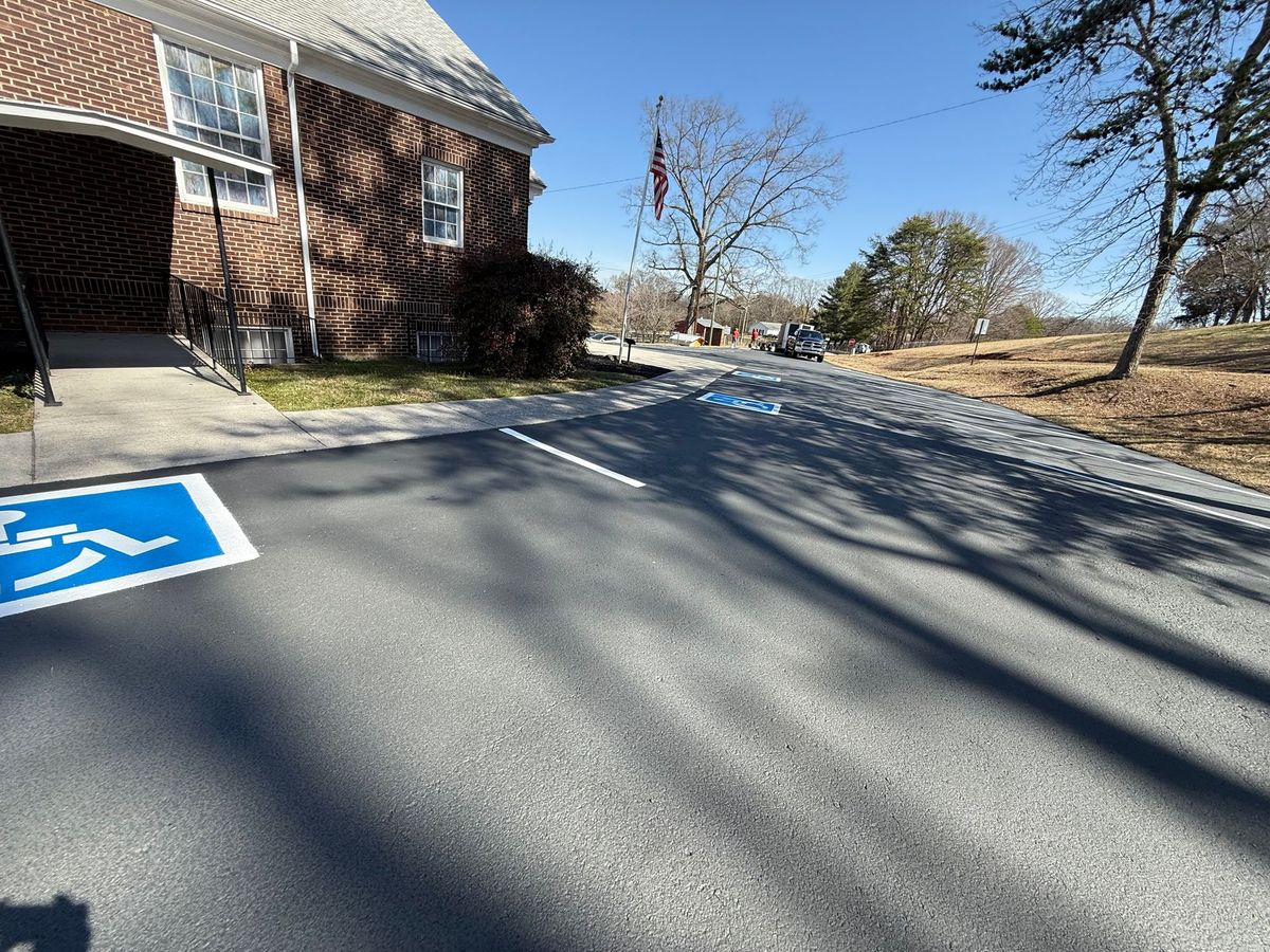 Our parking lot was resurfaced and restriped March 11 & 12, 2025