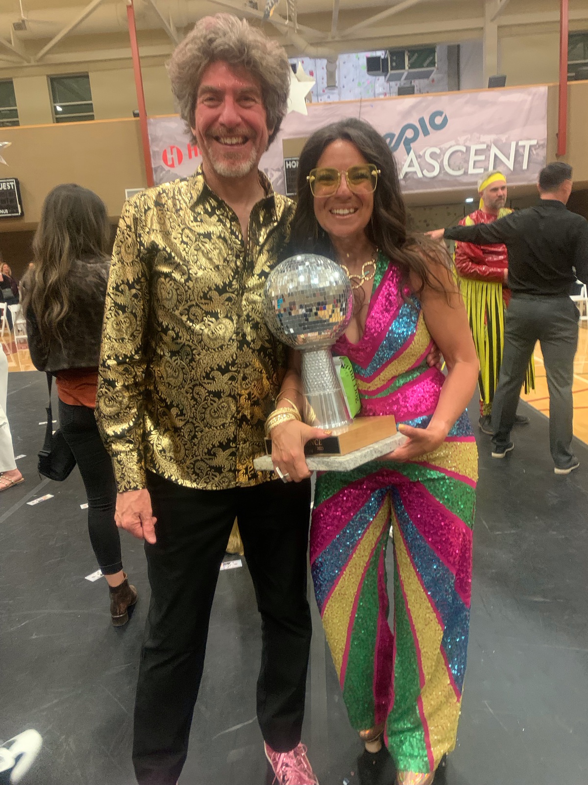 Parishioner Jen Nadler (pictured here with Deacon David) won the Suicide Prevention Disco Contest.