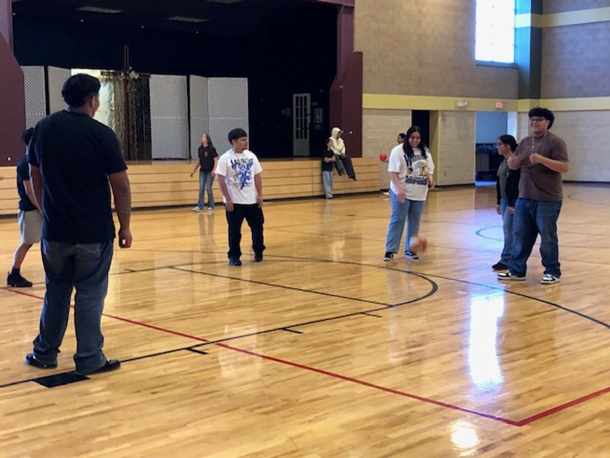 Confirmation Students shoot some hoops before the retreat begins.