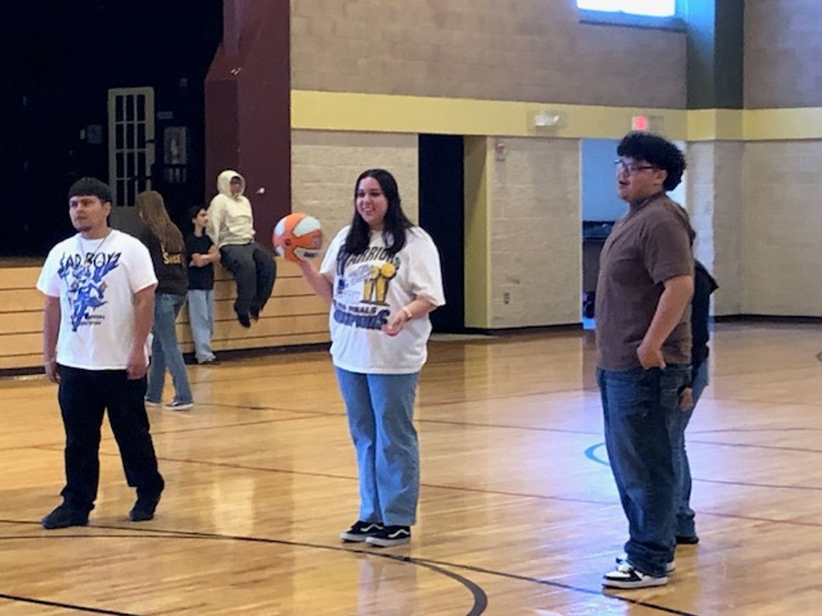 Confirmation Students shoot some hoops before the retreat begins.