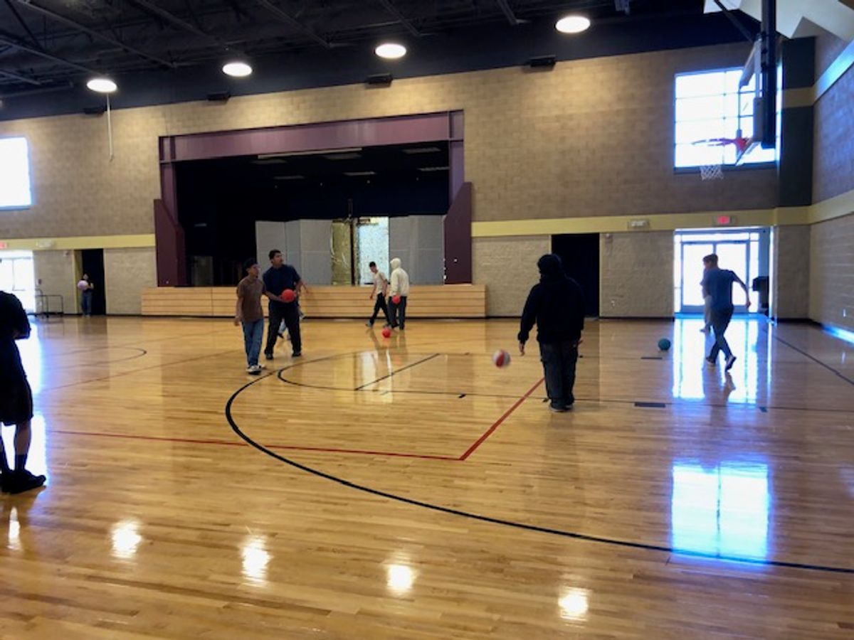 Confirmation Students shoot some hoops before the retreat begins.