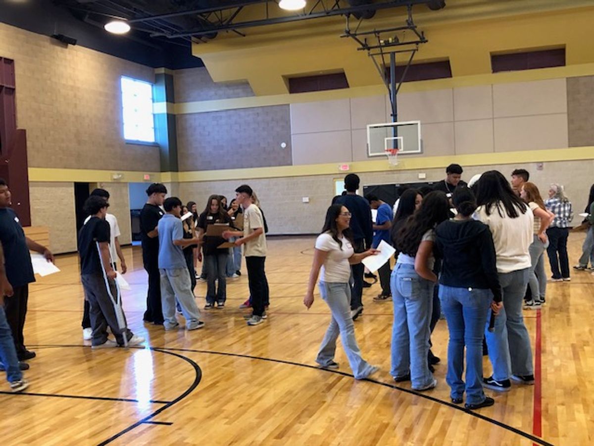 Students participate in “Name Badge Bingo” ice breaking game.