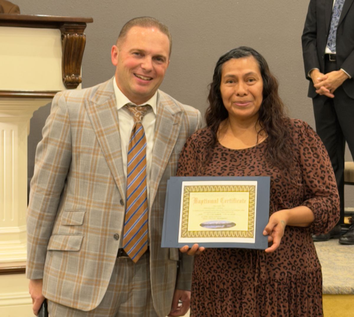 Pastor Bohannon Presents a Baptism Cert to Sis Felisitas Xinol at TLC
