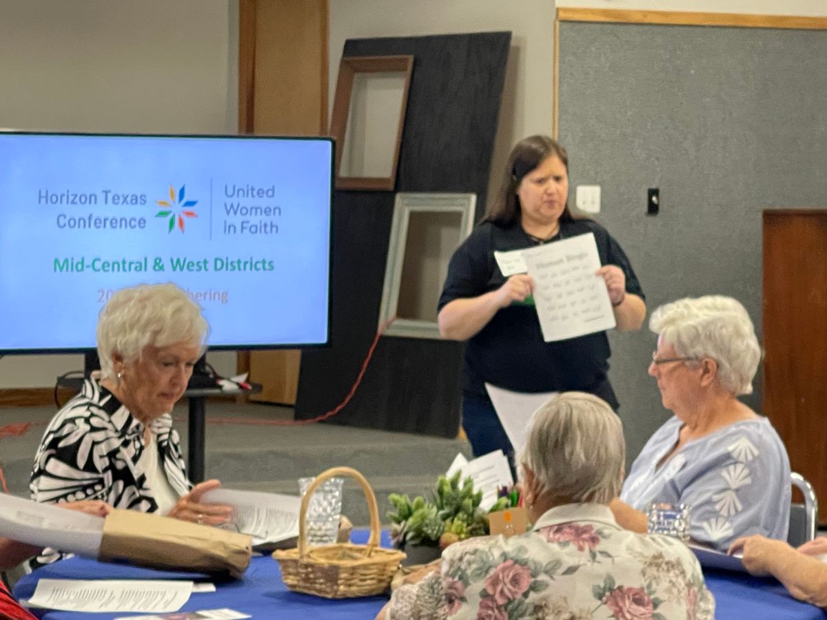 Mary Lou Felch, UWFaith MCW District Communications Coordinator & UWFaith MCW District Unit Communications Coordinator, explains the Human Bingo icebreaker game.