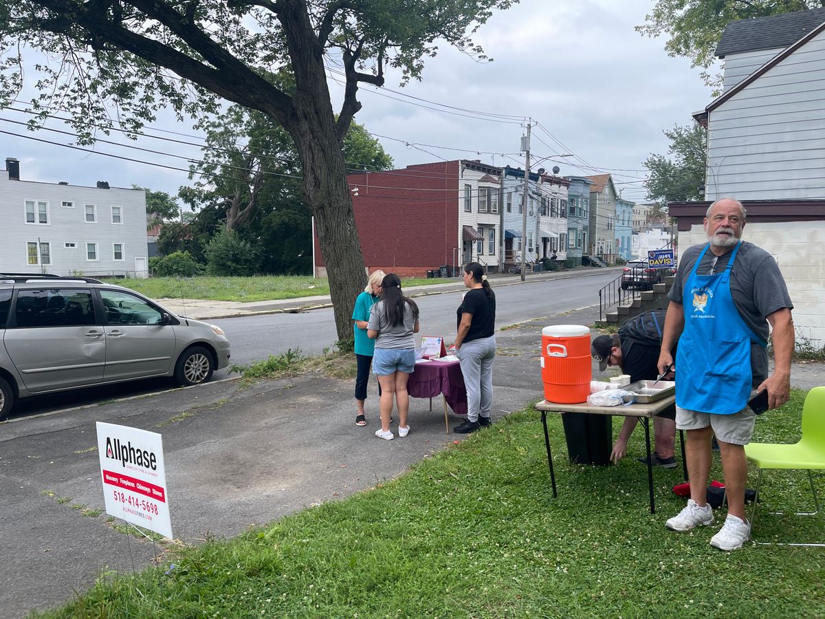 Al on lemonade duty; Chaplain Candy offering a prayer for a guest