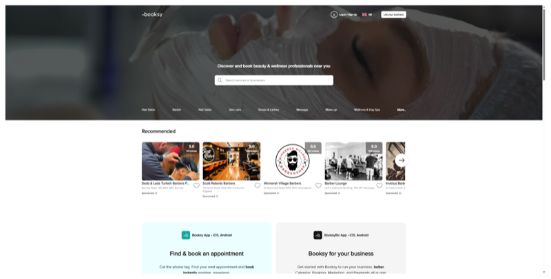 Booksy homepage with a search bar for beauty and wellness professionals and a row of recommended barbershops