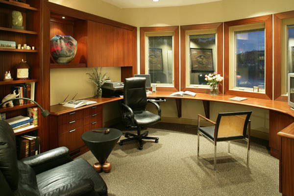 Custom home office with wrap-around desk taking advantage of the beautiful lake view.