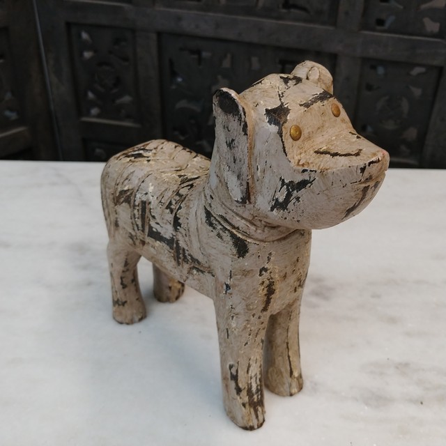 carved wooden dog