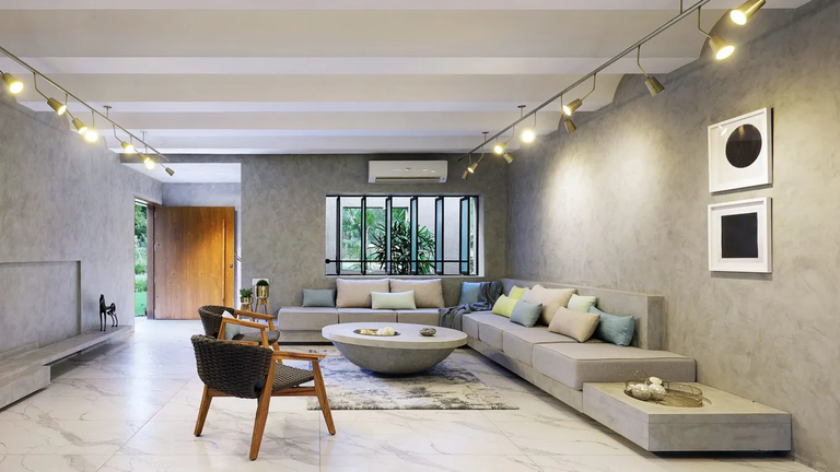 Living Room, Hollywood Regency style, glamorous and indulgent, bold and vibrant colours, velvet and silk, mirrored surfaces, high-gloss finishes, dramatic and oversized furniture, statement lightning 