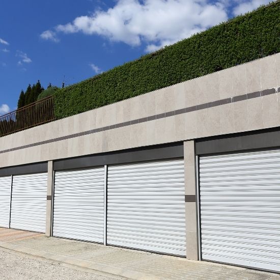 How often should garage doors be serviced or maintained?