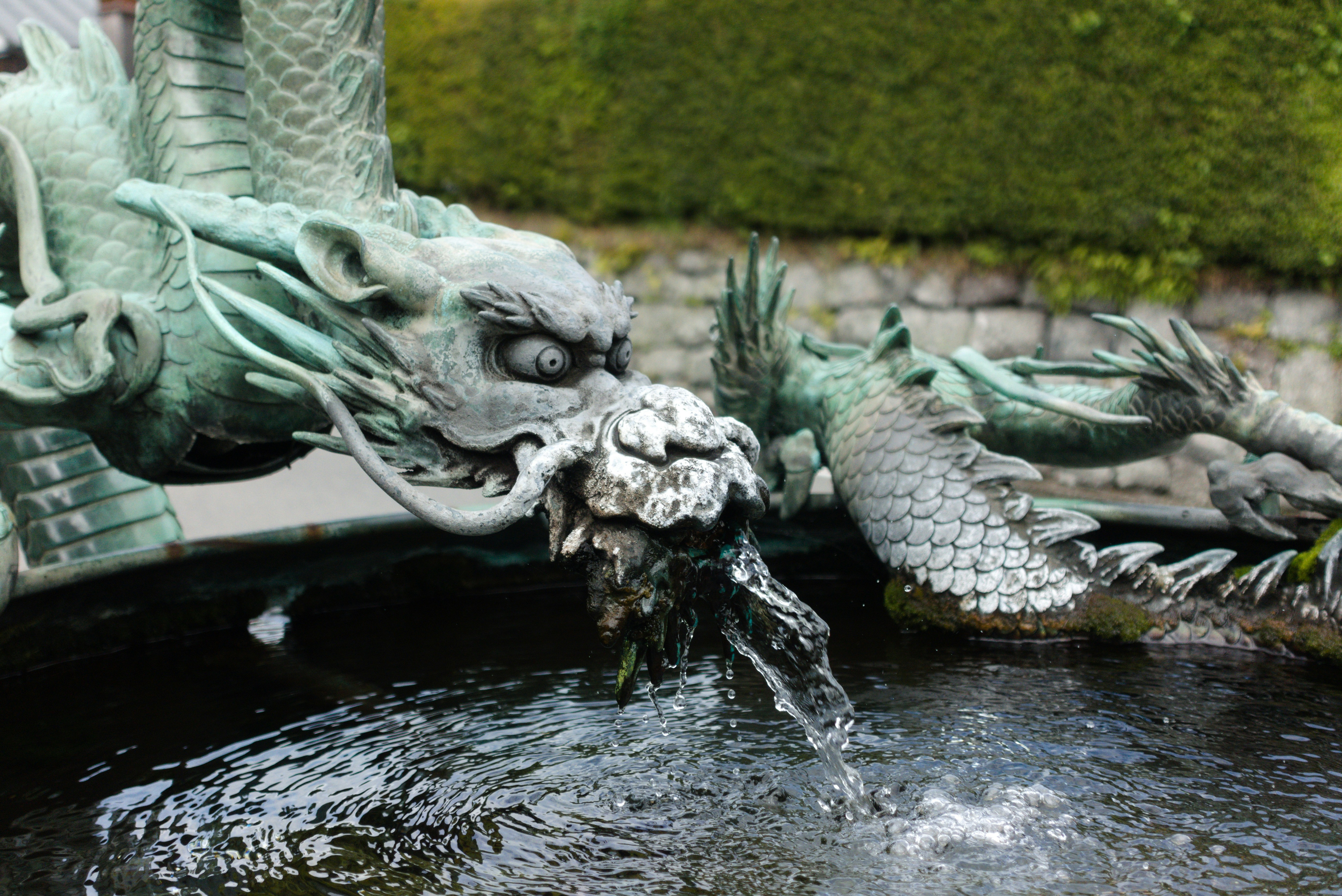 a-dragon-fountain-with-water-flowing-from-its-mouth-gabriele-girelli