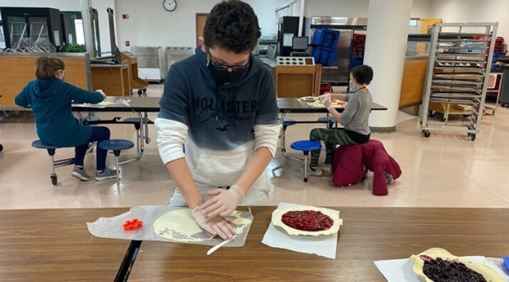 Student baking pies
