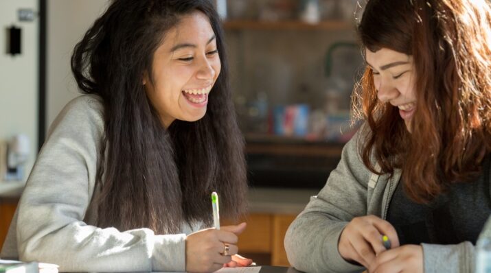 Two female High School students collaborating