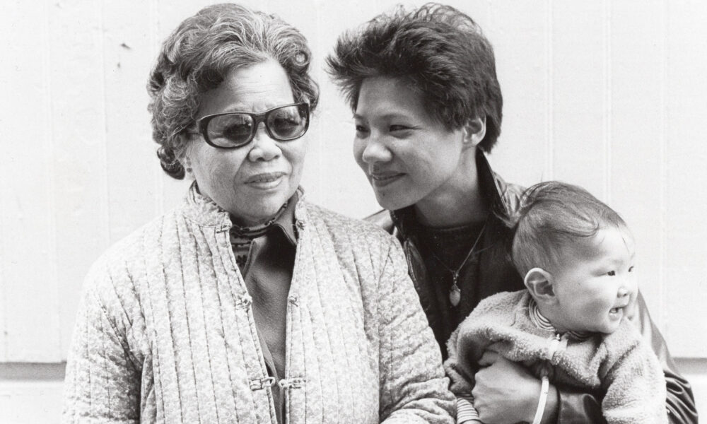 An older Asian woman and younger Asian woman and a baby