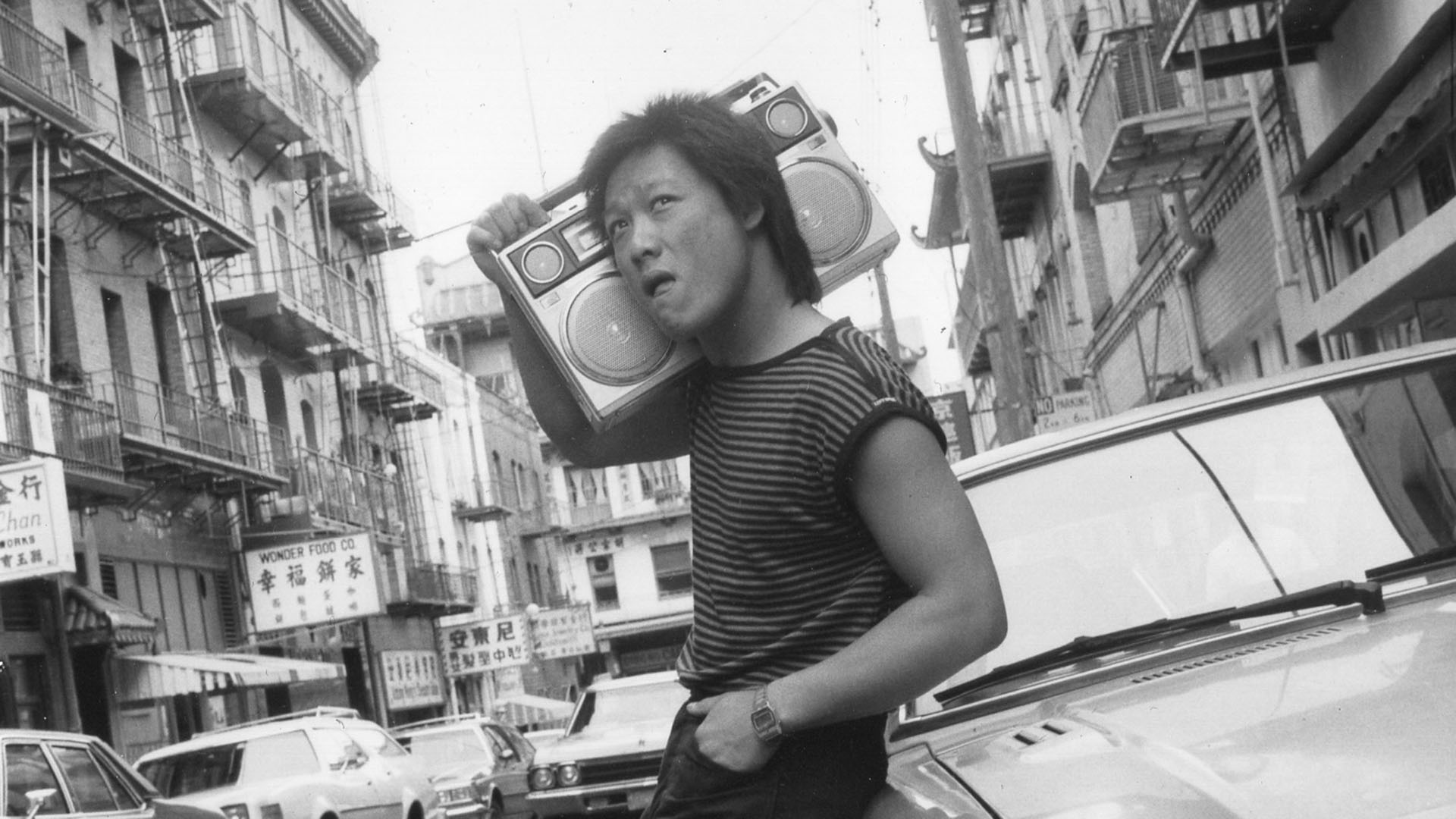 Young Asian man with radio