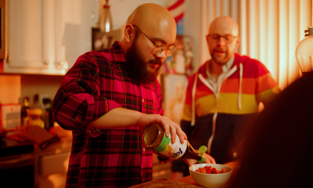 Filipino man with beard serves food