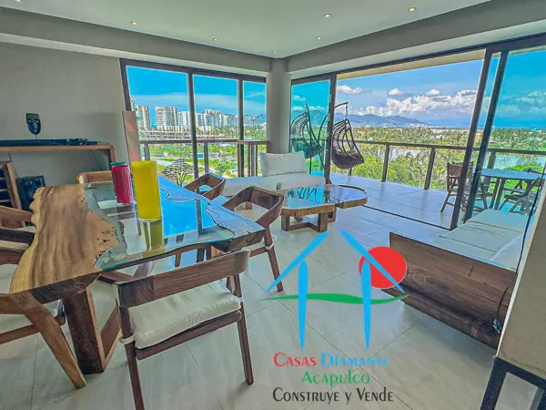 Depa en condominio de playa con terraza en L y vista parcial al mar