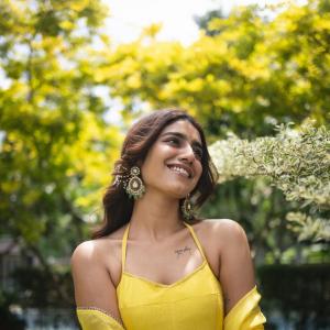 Actress Priya Warrier Radiates Elegance in Yellow Dress – Latest Photos