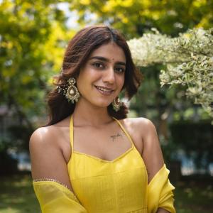 Actress Priya Warrier Radiates Elegance in Yellow Dress – Latest Photos