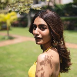 Actress Priya Warrier Radiates Elegance in Yellow Dress – Latest Photos