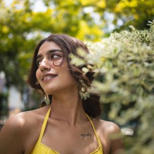 Actress Priya Warrier Radiates Elegance in Yellow Dress – Latest Photos